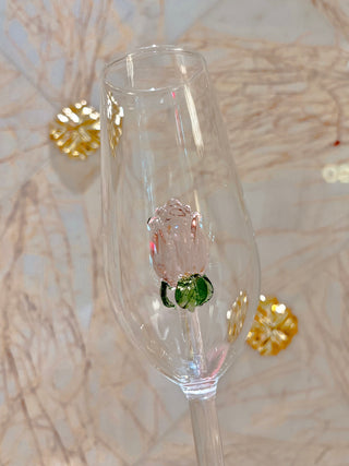La Vie En Rose Champagne Glass Set of 2 close up with a marble veined backsplash.