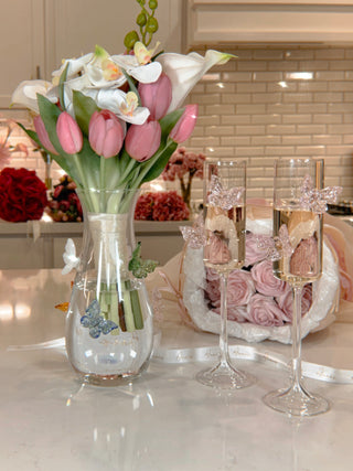 Butterfly Whispers Glass Vase next to Anais' Butterfly Dreams Champagne Flutes