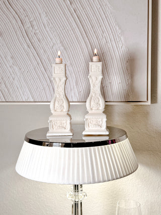  Stair Balusters Candle Set of 2 placed atop a luxurious, reflective lamp.
