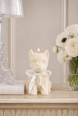 Charming White Terrier Puppy Candle on a luxurious, modern credenza