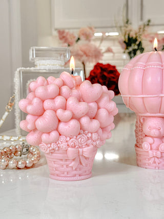 A close up photo of the Balloon Bear Candle in French Rose Pink.