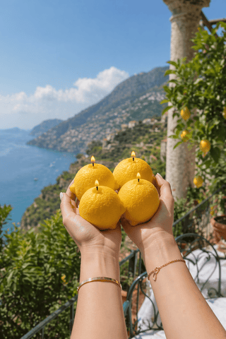 Amalfi Limone Candle Set of 4 displayed in a luxury beachfront residence