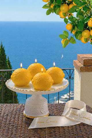 Amalfi Limone Candle Set of 4 on a Calacatta marble dining table