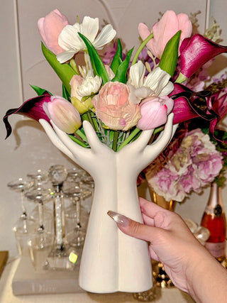 A woman with fancy nails holding a Luxurious Hand Ceramic Vase.