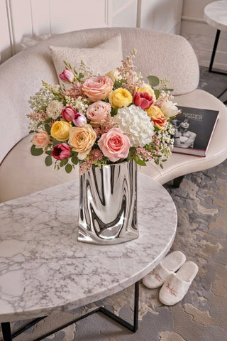The Luxe Bag Vase seen in a boutique hotel's living room.