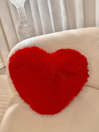 A Loving Heart Throw Pillow - 100% Lamb Fur on wool couch alternate angle 3.