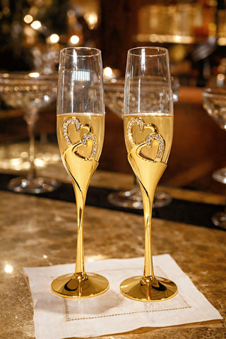 The Imperial Diamond Heart Champagne Flute Set of 2 at a luxurious bar