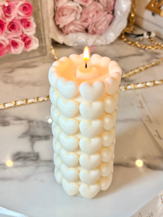 Million Hearts Candle with a lit flame.