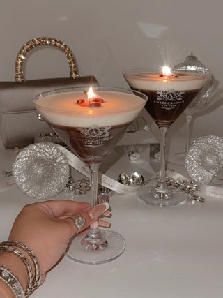 A woman toasting with the Lux Espresso Martini Candle.