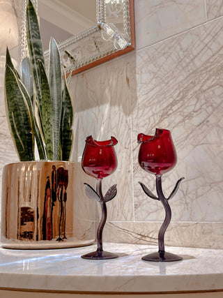 Rose for Rose Glass Cup Set of 2 on marble veined countertop, crystal adorned mirror and gold potted planter.