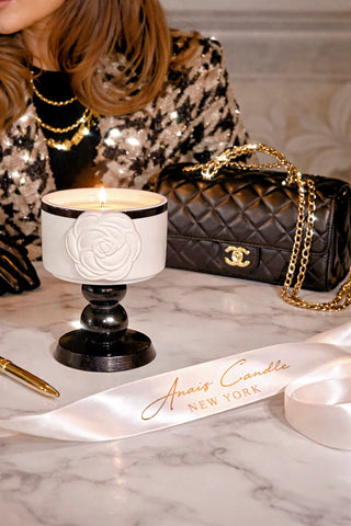 Camélia Maison Candle styled for a romantic luxury lifestyle scene.