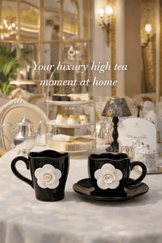 Camellia Romance ceramic tea cups displayed on a marble dining table