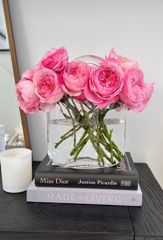 Olivia Glass Handbag Vase with pink flowers.