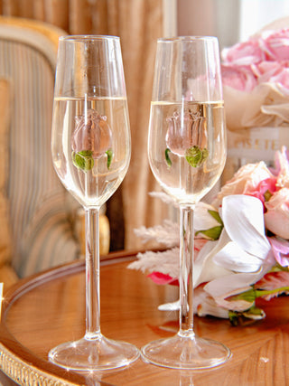A La Vie En Rose Champagne Glass Set of 2 with bubbly champagne.