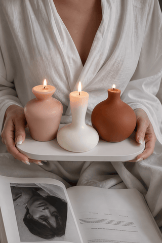 Casa Organic Modern Vessel Candle Set of 3 on a polished stone console table