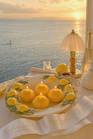 Amalfi Limone Candle Set of 4 on a marble coffee table in a coastal villa