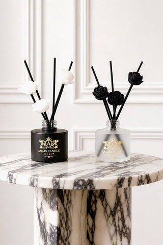 Noir et Ivoire Diffuser Set on a marble vanity in a luxury hotel bathroom