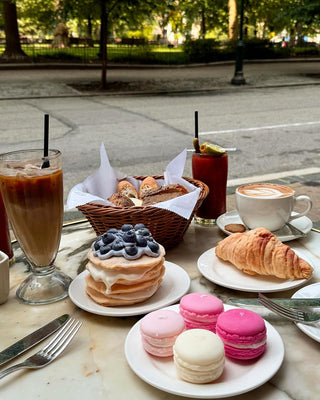 French Croissant Candle blending in with an outdoor brunch setup.