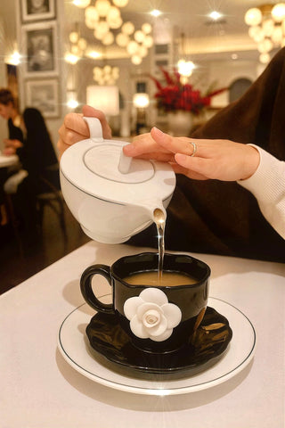 The Camellia Romance Ceramic Tea/Coffee Cup Set of 2 in a Parisian Coffee Shop.
