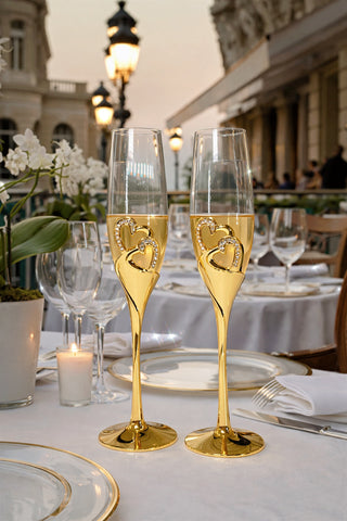 The Imperial Diamond Heart Champagne Flute Set of 2 at an outdoor restaurant in Paris