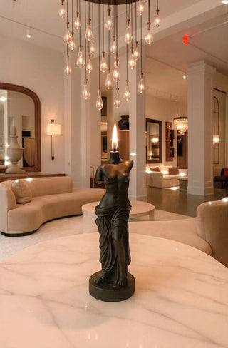 The Venus Candle in Ultra Black in a 5-star hotel lobby.