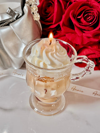 Vanilla Ice Cream Latte Candle next to white lace Anaïs ribbon and a red rose bouquet.