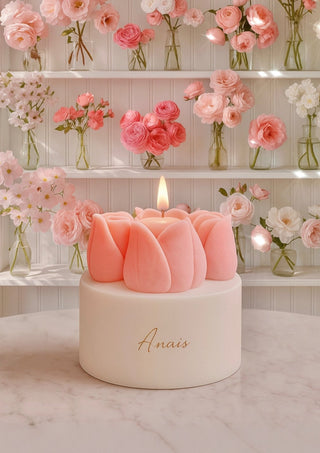Amélie Tulips Bouquet Candle is displayed on a coffee table or fireplace mantle.