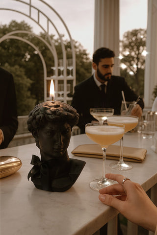 The Anaïs Man Candle in Ultra Black at a wedding event.