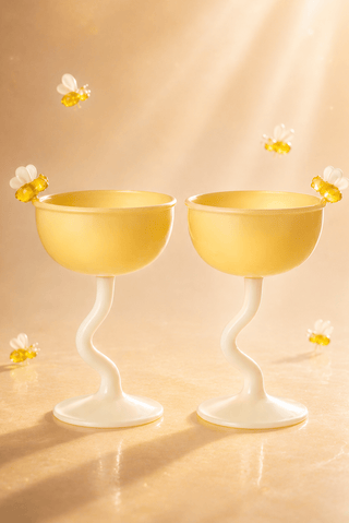Summer Bee Glass Cup Set Of 2 on a marble terrace overlooking the coast