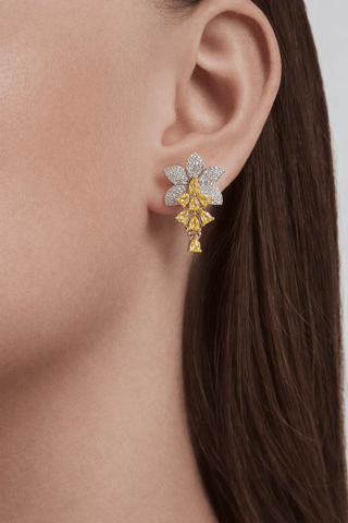 Rosemary Floral Yellow Sapphire Earrings worn to an elegant dinner party.