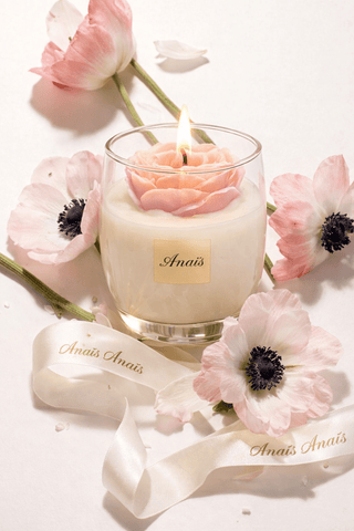 Austin Rose Candle surrounded by lush pink florals