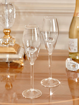 ‘100-Carat’ Diamond Champagne Flute Set of 2 on a luxuriously handcrafted nightstand.