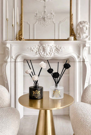 Noir et Ivoire Diffuser Set beside designer perfume bottles