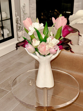 A Luxurious Hand Ceramic Vase atop an acrylic side table.