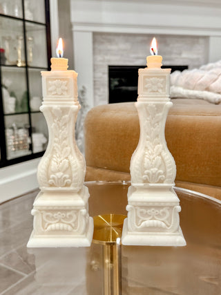  Stair Balusters Candle Set of 2 placed atop an acrylic table.