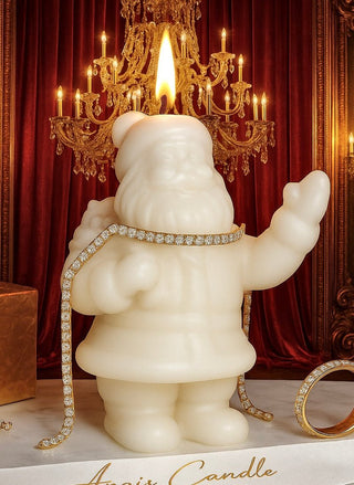 A lit Holiday Santa Candle featuring an adorable cozy, standing Santa Claus figure.