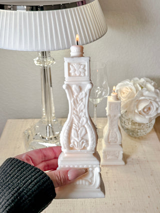 Stair Balusters Candle gently held in a woman's hand.