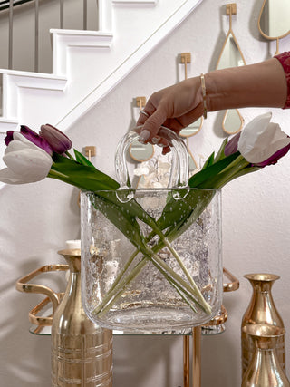 Olivia Glass Handbag Vase showcased next to luxury spiral staircase.