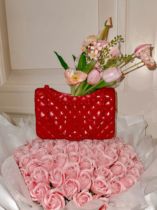 Anastasia Handbag Resin Vase in Lipstick with pink roses.