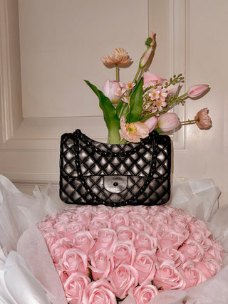 Anastasia Handbag Resin Vase in Ultra Black with pink roses.