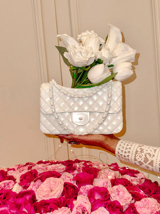 Anastasia Handbag Resin Vase in White surrounded by florals.