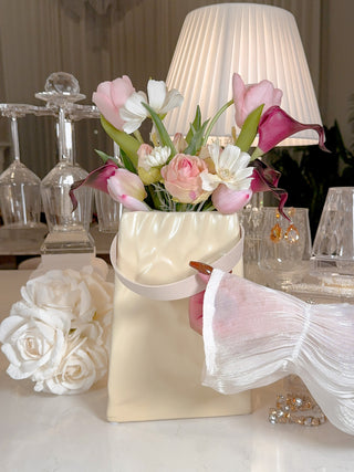 Aria 'Paper Bag' With Leather Strap Ceramic Vase surrounded by luxurious kitchen decor and florals.