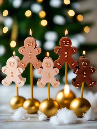 Holiday Gingerbread Friends Candle Crew Set of 5 on gold holiday sticks.