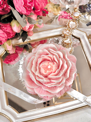 Blooming Peony Candle - XXL atop a lavish gold and white mirror tray.