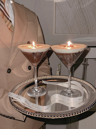 Two lit Lux Espresso Martini Candle giving off aromatic espresso scents.