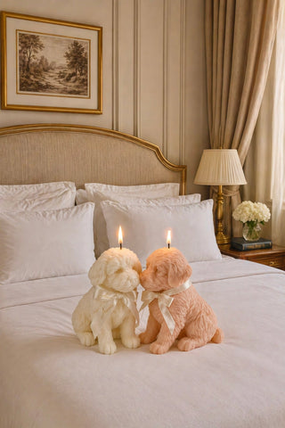 Anaïs Puppy Candle Set on a high end boutique hotel's fresh linens