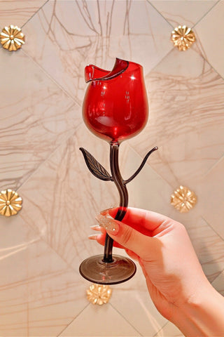 A woman toasts with teh Rose For Rosé Glass Cup at a special event.