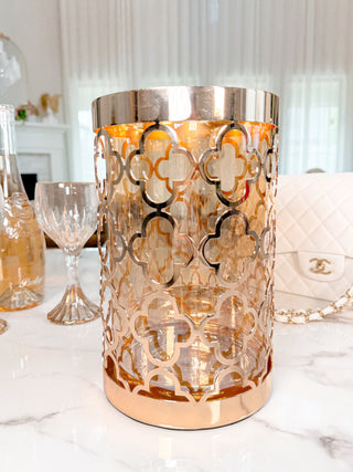 Timeless Metal Four-Leafed Clover Glass Vase - XXL atop a marble dining table.