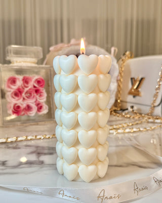 Million Hearts Candle atop a marble dining table.