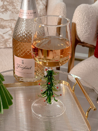 Christmas Tree Glass Cup - Handmade next to a bottle of Prosecco Rosé.